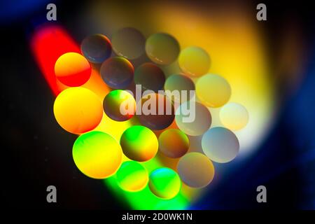 Oil drops in the water create an artistic and imaginatively designed abstract background Stock Photo
