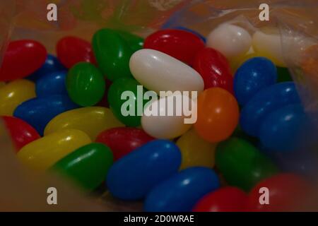 Multicolored rainbow balls, sweet jelly beans, selective focus, fun colored abstract background. Stock Photo