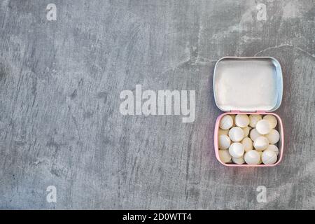 cute Pill box on grey background, copyspace Stock Photo