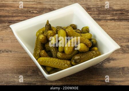 Pickled young gherkin in the bowl Stock Photo