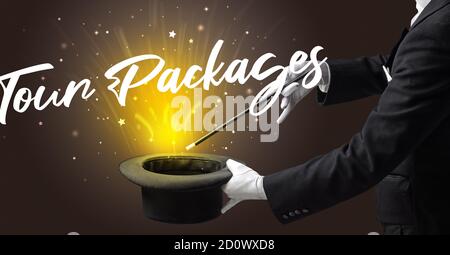 Magician is showing magic trick with Tour Packages inscription, traveling concept Stock Photo