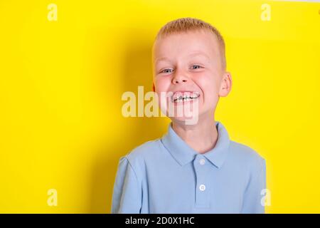 boy smile without upper baby tooth. A hole in a child's smile. Cheerful concept.Health care, dental hygiene. Stock Photo