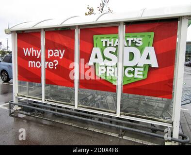 London, UK. 3rd Oct, 2020. Asda's famous slogan 'thats Asda Price' seen on the side of a trolley station at one of their super-centres.UK's third biggest supermarket chain Asda has been sold by its US owner Walmart.Billionaire brothers Mohsin & Zuber Issa and private equity firm TDR Capital won the bidding war in a Â£6.8billion deal. The Blackburn based Issa brothers own EG Group, which they built from a single petrol station in 2001 to more than 6,000 sites around the globe and an annual turnover of Â£20billion. It will be the first time Asda has been in British ownership for o Stock Photo