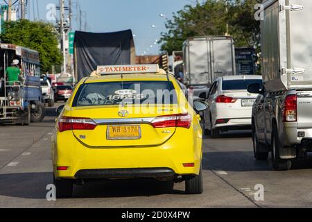 SAMUT PRAKAN, THAILAND, JUN 23 2020, The yellow taxi waiting in line on the street. Slow driving in a traffic jam. Stock Photo