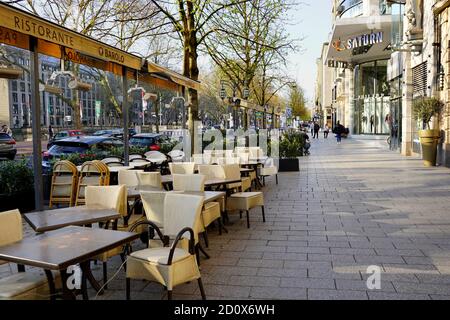 Königsallee in downtown Düsseldorf during Corona lockdown. It is usually one of the busiest shopping streets in Germany. Stock Photo