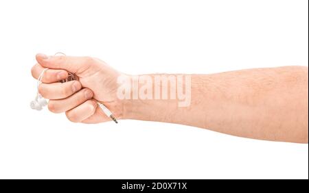 male hands are holding white headphones isolated on white Stock Photo