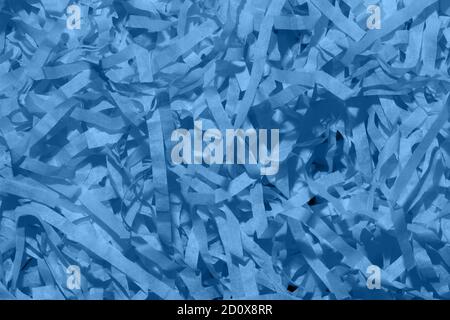 Photography on the theme of the trend color 2020. Set of blue thin paper confetti photographed close-up. Stock Photo