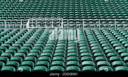 Rows of outdoor stadium seating extending into the distance. Stock Photo