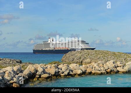 Holland American Line Cruise ship Zuiderdam anchore offshore in Half Moon Cay (Little San Salvador Island), Bahamas. Stock Photo