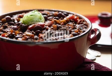 large healthy pot of plant based vegan chilli con carne ready to  serve. shot for recipes and copy-space in selective focus Stock Photo