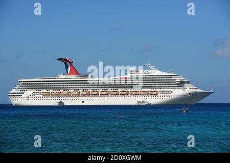 Carnival Cruise ship Victory anchore offshore in George Town, Cayman Islands. Stock Photo
