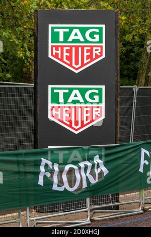 TAG heuer and Flora sponsorship signs seen at the route of the 40th