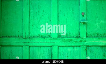 Bright Green Distressed Wood Painted Garage Door Stock Photo
