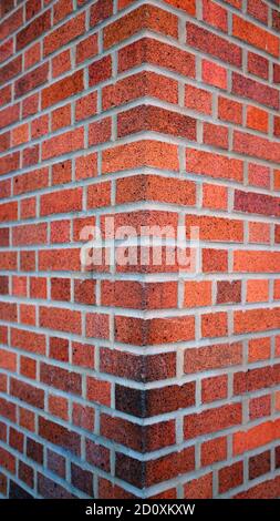 Corner of Bright Red Brick Building (Vertical) Stock Photo