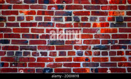 Grungy red and black brick wall Stock Photo