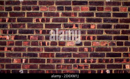 Red Brick Wall in Distressed Condition Stock Photo