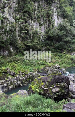 Rock, shimenawa rope, and river around Takachiho Gorge in Miyazaki ...