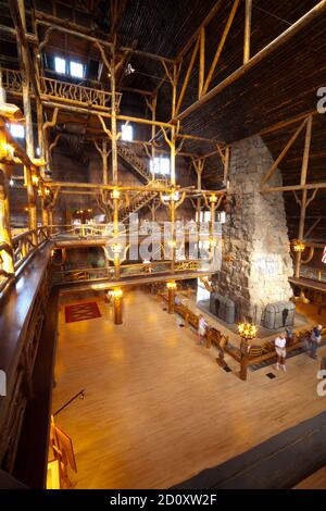 Built in 1903 to 1904, the Old Faithful Inn, a five story log building with a massive 500 ton native stone fireplace had electric lights when opened. Stock Photo