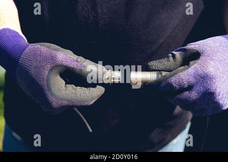 In preparation for a concert, the sound engineer is connecting the audio cables Close-up Stock Photo