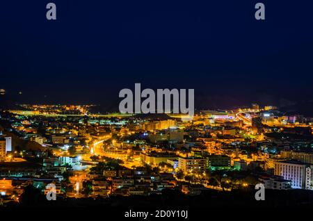 Illuminated cityscape of Muscat, Oman. Long Exposure Photography. Stock Photo