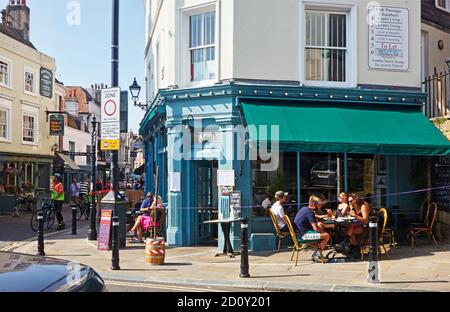 People eating outside at Fagin's restaurant, on the corner of George street, Hastings, Old Town, East Sussex, UK in 2021 Stock Photo