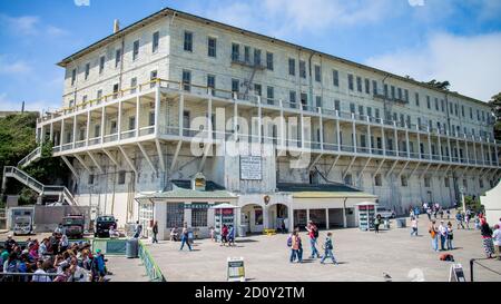 San Francisco, California, USA - August 2014: Alcatraz prison building with tourists visiting Stock Photo