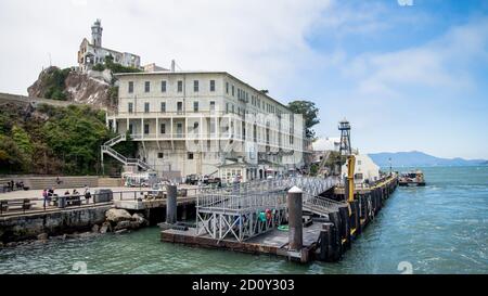 San Francisco, California, USA - August 2014: Alcatraz prison building with tourists visiting Stock Photo