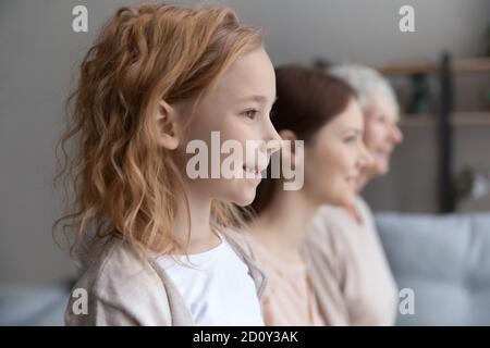 Close up three generations of women standing in row Stock Photo