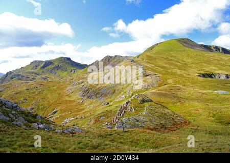 Group of walkers ascending Moelwyn mawr with views of Moelwyn bach and viewed from Moel yr hydd Stock Photo
