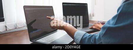Software developer or programmer working data debugging improvement binary algorithm on desktop pc in a software develop company office Stock Photo