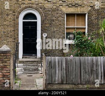 30 June 2020 - London, England: Georgian front door and window of period house Stock Photo