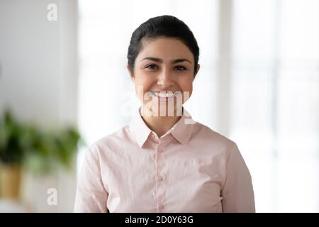 Profile picture of smiling Indian female employee Stock Photo
