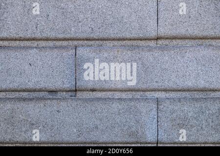 Detailed closeup of a gray seamless brick wall background Stock Photo