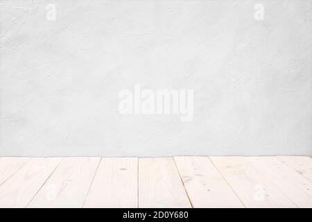 Empty white wooden deck table over white textured wall background. Mock up template. Copy space Stock Photo