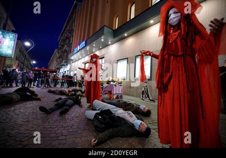 Turin, Italy. 3rd Oct, 2020. Extinction Rebellion activists perform a die-in protest to support the projection of The Troublemaker movie at XXIII Cinemambiente festival. Credit: MLBARIONA/Alamy Live News Stock Photo