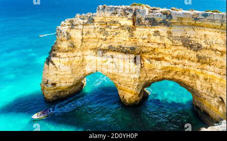 Landscape with natural arch, near Praia da Marinha, one of the most famous place of Portugal, located on the Atlantic coast in Lagoa, Algarve. Stock Photo