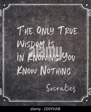 The only true wisdom is in knowing you know nothing - ancient Greek philosopher Socrates quote written on framed chalkboard Stock Photo