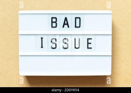 Lightbox with word bad issue on wood background Stock Photo