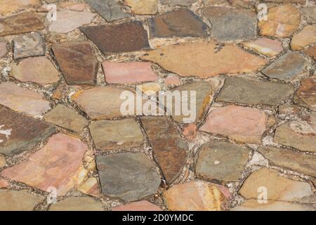 track from textured brown and pink sandstone, Background Stock Photo