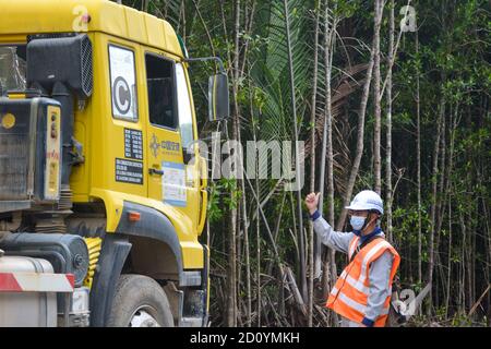 Kuala Lumpur, Malaysia. 30th Sep, 2020. Liu Zhixin, a 25-year-old technician of China Communications Construction Company (CCCC), works at the construction site of the East Coast Rail Link (ECRL) rail project in Paka, Terengganu, Malaysia, Sept. 30, 2020. TO GO WITH 'Feature: Young Chinese technician spends first oversea Mid-Autumn Festival at site of Malaysia's ECRL rail project' Credit: Ye Huiyuan/Xinhua/Alamy Live News Stock Photo