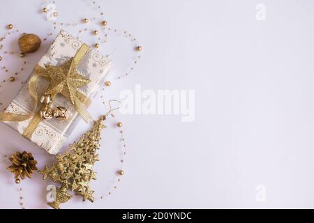 New Year's composition. Christmas gift, pine, nut, on a white background. Top view, flat deck chair, copy space. place for inscription Stock Photo