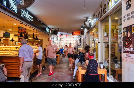 Tapas on display at the counter of tapas bar 'Cava Aragonesa' in Calle Santo Domingo in the old town of Benidorm, Alicante Province, Spain Stock Photo