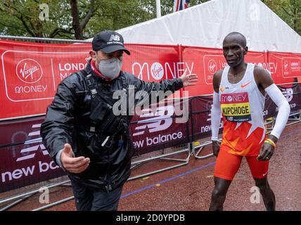 Kenya's Eliud Kipchoge reacts as he leaves The Mall after only finishing 8th in the Elite Men's Race during the Virgin Money London Marathon around St James' Park. Stock Photo