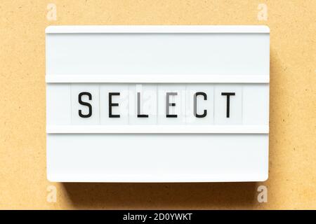 Lightbox with word select on wood background Stock Photo