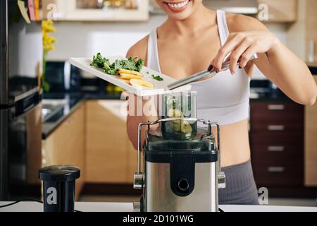Woman making healthy juice Stock Photo