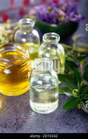 Bottles of essential oils for aromatherapy treatment. Stock Photo