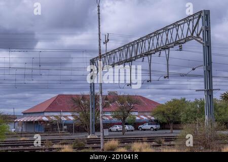 Leeu Gamka, South Africa - the Leeu Gamka hotel viewed from across the railway lines in this small central Karoo town next to the N1 motorway Stock Photo