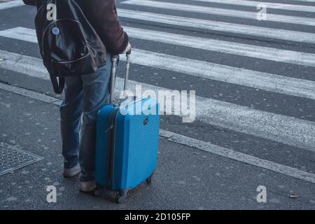 Bologna: A girl with a suitcase is leaving before the total lockdown in Italy. (Covid-19 pandemic 2020) Stock Photo
