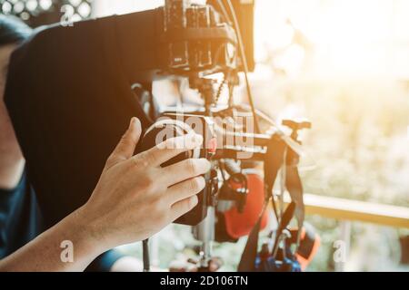 Hand focus puller or first assistant camera working in film shooting Stock Photo