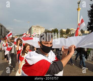 Kiev, Ukraine. 4th Oct, 2020. People attend a rally of solidarity with protests in Belarus in Kiev, Ukraine, 4 October 2020. Members of the Belarusian community in Ukraine and their supporters held the rally of solidarity with the Belarusian protests against the results of the presidential election. Credit: Serg Glovny/ZUMA Wire/Alamy Live News Stock Photo